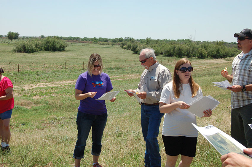 image of volunteers in field