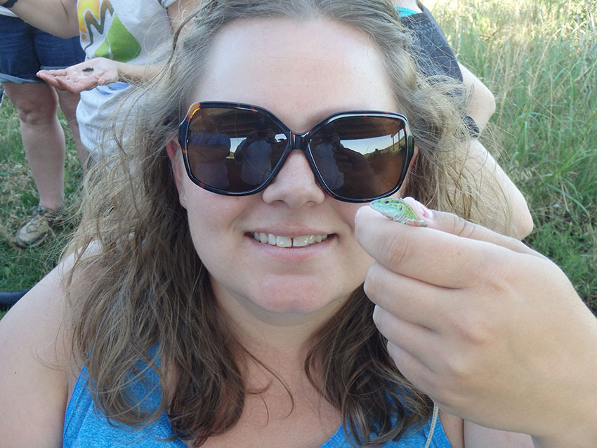 image of woman holding a lizard