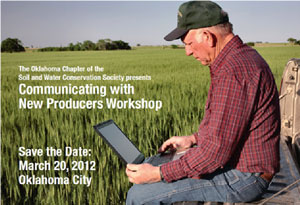 image of man on computer in field