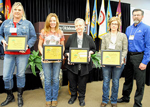 image of employees holding awards