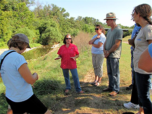 image of people viewing streambank