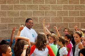 image of students with hands raised