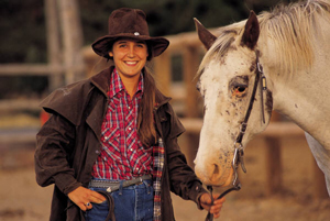 image of young woman with horse 