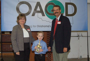 image of OACD President presenting student with an award