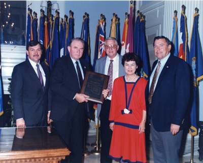 image of Bellmon accepting OACD President's Award in 1989. 