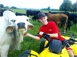 image of young boy with a cow